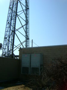 Cell phone tower and base station where Absolute Building Concepts completed site preparation, exterior maintenance, and commercial repairs.