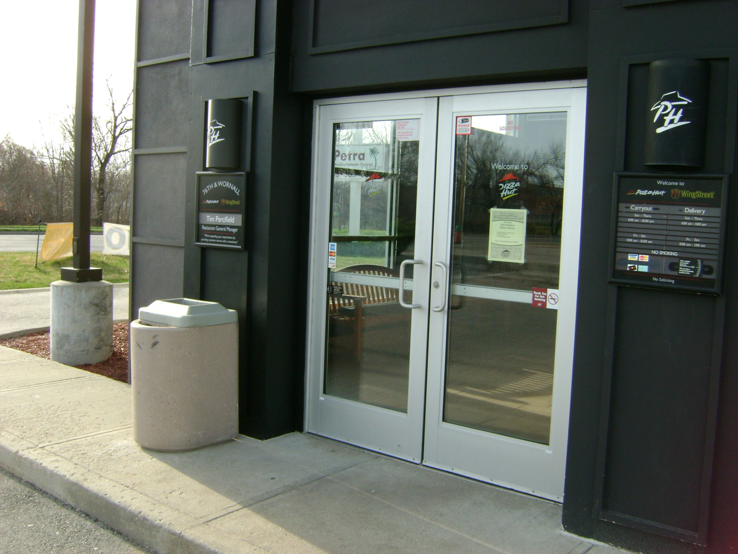 Restored exterior of a commercial restaurant after structural repairs and reconstruction following a vehicle impact.